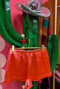 pastel red silk shorts