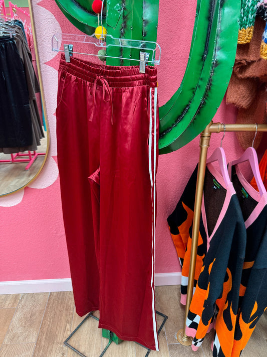 red silk track pants